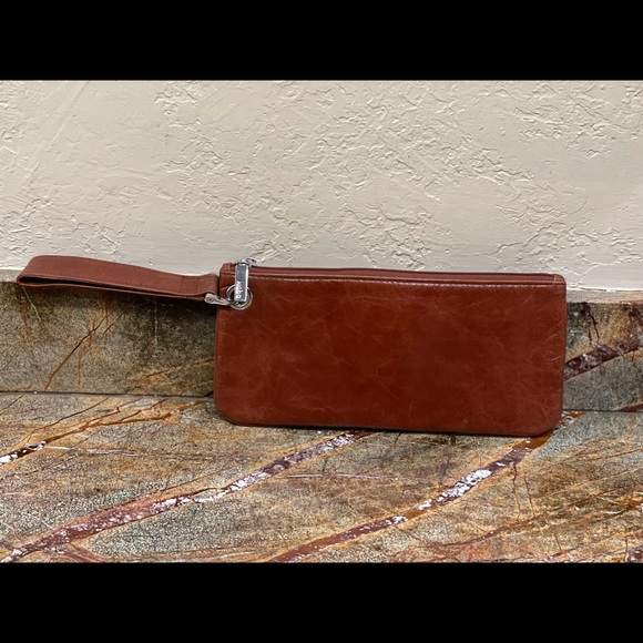 HOBO Handbags - HOBO clutch with wrist strap. Brown.